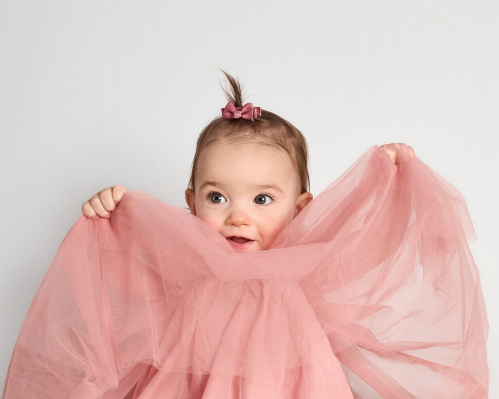 A sweet baby girl photograph with a big smile