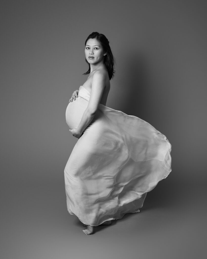 Full length pregnancy portrait with flowing fabric
