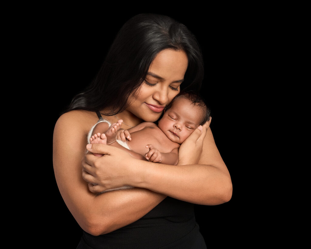 Classic black backdrop newborn portrait with mother – London newborn photographer